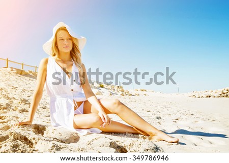 Similar – Young, slender, long-legged woman on a Baltic beach in a summer dress