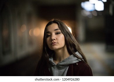 Portrait Of Young Pretty Woman In Subway. Night