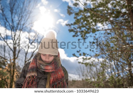 portrait Young pretty woman in winter in the snow