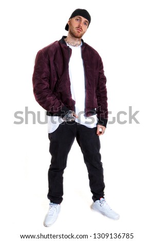 portrait of young rapper in the studio on a white background