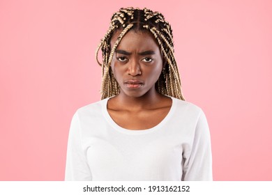 Portrait Of Young Sad African American Woman Feeling Upset And Depressed, Looking At Camera. Worried Black Lady With Serious Concerned Facial Expression And Sorrow Emotion Isolated On Pink Background