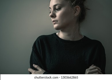 Portrait of young sad woman with anxiety disorder, anorexia ans loneliness concept
