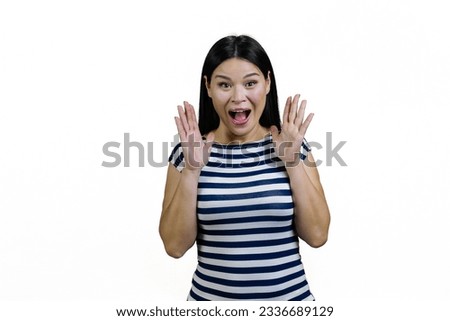 Portrait of a young screaming yelling asian woman. Isolated on white.