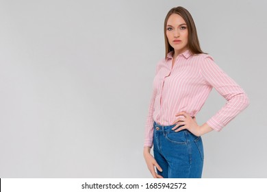 Portrait Of A Young Serious Woman Standing Monochromatic Background