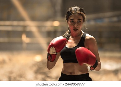 Portrait young sexy confident Muay Thai boxing with boxing gloves ready to fight