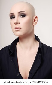 Portrait Of Young Skinhead Woman With Smoky Eyes Make-up