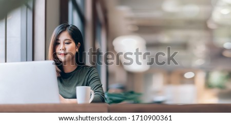 Portrait of Young Smart Asian Woman Freelance Online Working from Home with Laptop at Home Living Room in Coronavirus or Covid-19 Outbreak Situation - Healthcare and Social Distancing Concept