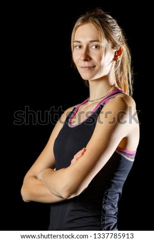 Similar – Close up front upper body portrait of one middle age athletic woman in sportswear in gym over dark background, looking at camera and smiling