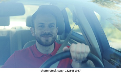 Portrait Young Smiling Man Driving A Car On A Road Trip Sunset Sunlight Transport Holiday Happy Adventure Car Short Hair Free Time Journey Smiling Summer Travel Slow Motion