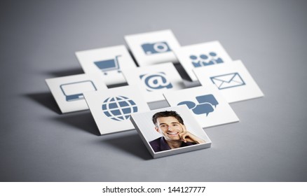 Portrait Of Young Smiling Man With Tecnology Icons