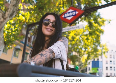 Portrait Of Young Smiling Woman At The Exit Of Metro Station In Madrid, Spain. Life Style Real Footage.