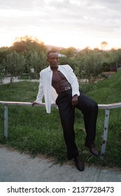 Portrait Of A Young South American Man Leaning On A Fence