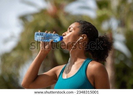 Similar – Image, Stock Photo Runner woman relaxed listening to music for training outdoors