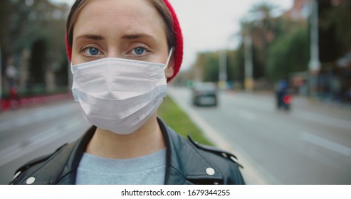 Portrait of a young student woman wearing protective mask on street.Concept of health and safety life, N1H1 coronavirus, virus protection, pandemic in china
