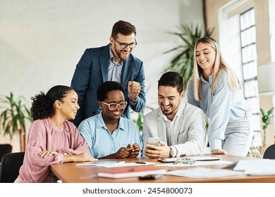 Portrait of young students or businesspeople having a meeting and using mobile phone in the office. Teamwork and success concept, portrait of a smart young businesspeople - Powered by Shutterstock