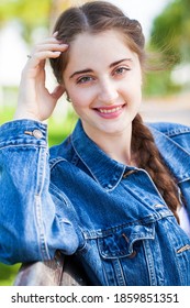 Portrait of a young stylish girl in in blue jeans jacket