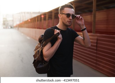 Portrait Of Young Stylish Man With Bag In The Street, Life Style.