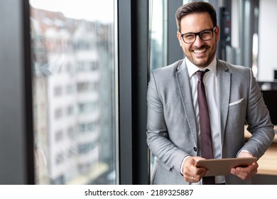 Portrait of young success business man with digital tablet in corporate office - Shutterstock ID 2189325887