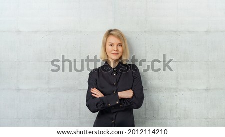 Portrait of young successful, strong business woman