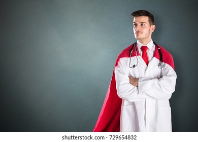 Portrait Of Young Superhero Doctor In Red Cape