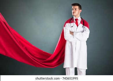 Portrait Of Young Superhero Doctor In Red Cape