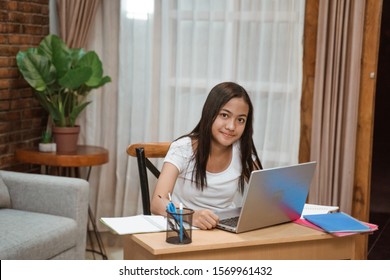 portrait of young teenager junior high school student studying at home