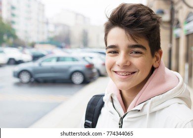 portrait of young teenager on city street