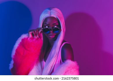 Portrait Of Young Tempting Bad Girl Wear High Fashion Couture Style Clothes Isolated On Fluorescent Pink Background