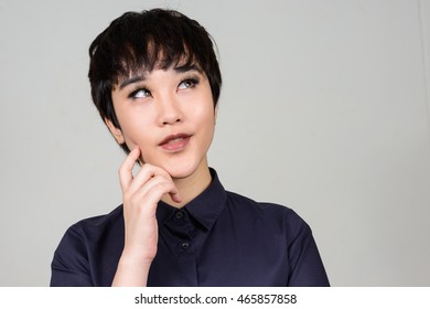Portrait of young transgender person thinking