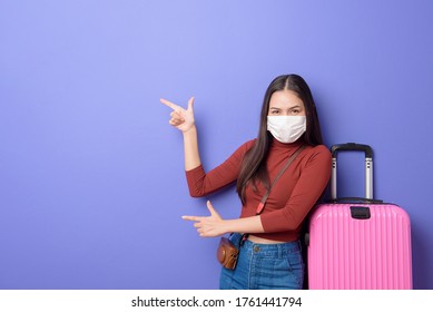 Portrait Of Young Traveler Woman With Face Mask , New Normal Travel Concept 