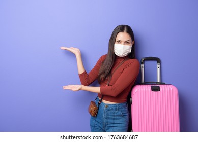 Portrait Of Young Traveler Woman With Face Mask , New Normal Travel Concept 