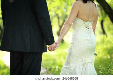 Portrait Of Young Wedding Couple, Back View, Outdoor