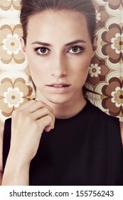 Portrait Of Young Woman Against 1970's Background