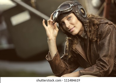 Portrait Of Young Woman Airplane Pilot. Fashion Model