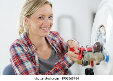 Portrait Of Young Woman Apprentice Plumber