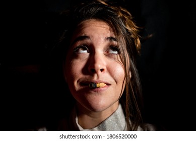 Portrait Of Young Woman With Bassoon Reed In Mouth