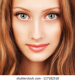 Portrait Of A Young Woman With Beautiful Hair And Green Eyes