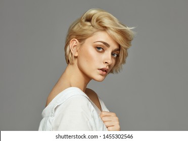 Portrait of young woman with blond short hair 
