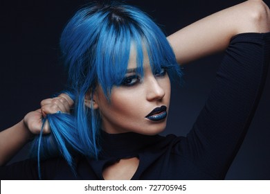 Portrait Of A Young Woman With A Blue Color Hair