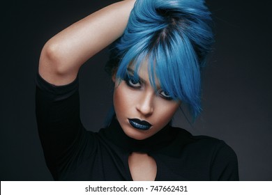 Portrait Of A Young Woman With Blue Color Hair