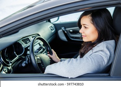 Portrait of a young woman in the car