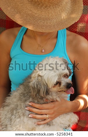 Portrait of young woman with chinese crested dog