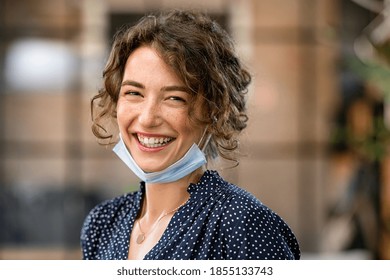 Portrait Of Young Woman With Covid-19 Protective Safety Mask. Businesswoman With Toothy Smile Wearing Face Mask And Looking At Camera. Successful Girl Wearing Protective Face Mask To Defeat Covid19.