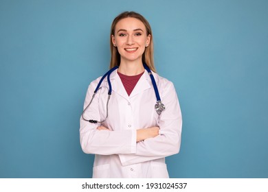 Portrait Of A Young Woman Doctor On A Blue Background