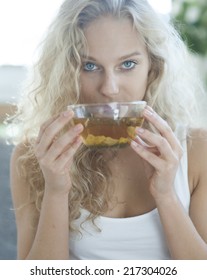 Portrait Of Young Woman Drinking Herbal Tea