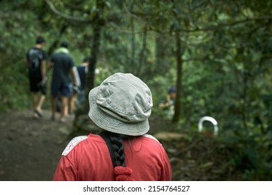 Portrait Of A Young Woman Explorer With Her Back Turned In The Jungle