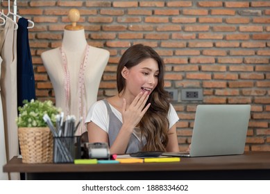 Portrait of young woman fashion designer working at her office, Startup small business entrepreneur - Shutterstock ID 1888334602