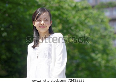 a portrait of young woman in the forest
