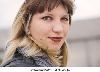 Portrait Of A Young Woman With Green Eyes And A Mole On A Pike. Girl Of Eastern European Descent. Russian Girl