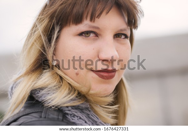 portrait of a\
young woman with green eyes and a mole on a pike. Girl of Eastern\
European descent. Russian\
girl